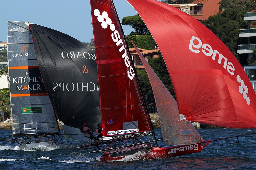 Smeg and The Kitchen Maker go hard for the bottom mark on the first lap of the course - Australian 18 Footers, League, Syd. Barnett Memorial Trophy,  Sunday, 14 December 2014, Sydney Harbour. © Australian 18 Footers League http://www.18footers.com.au